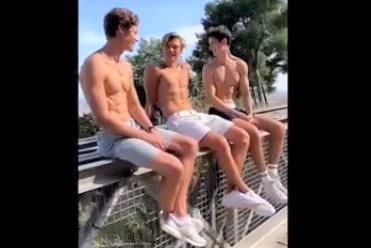 Boys on high railing